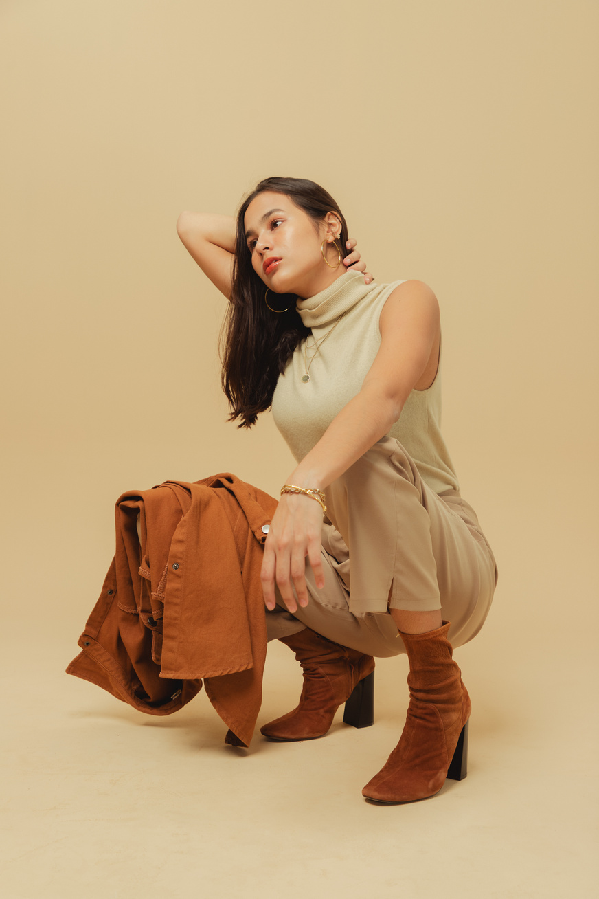 Woman in Beige Monochrome Outfit on Beige Background