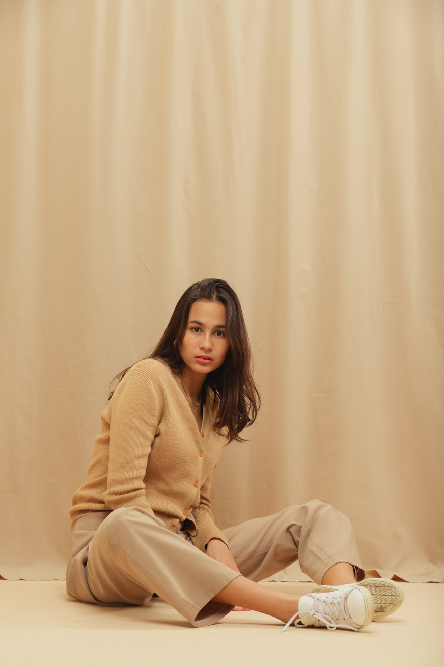 Woman in Beige Monochrome Outfit on Beige Background