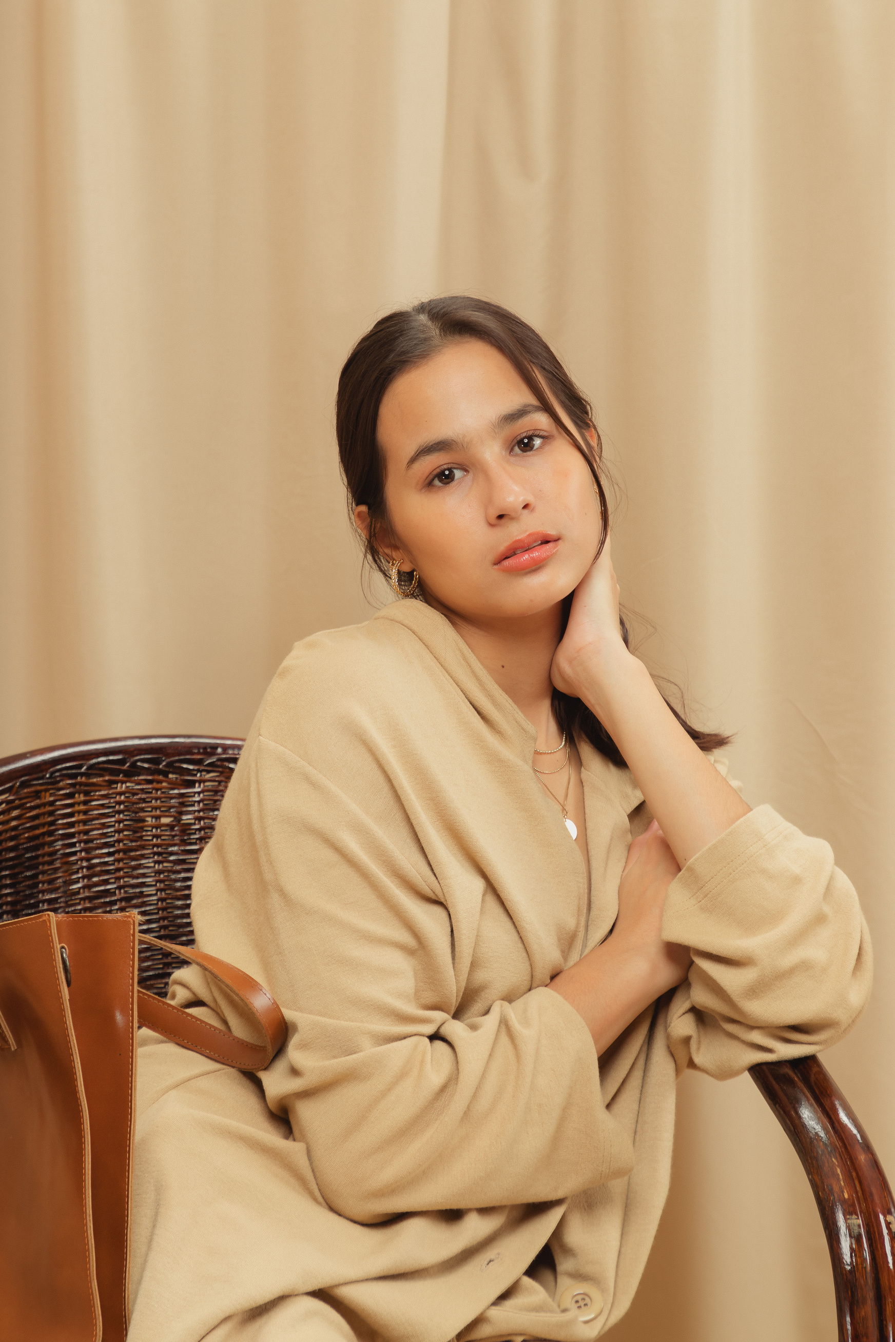 Woman in Beige Dress Shirt on Beige Background